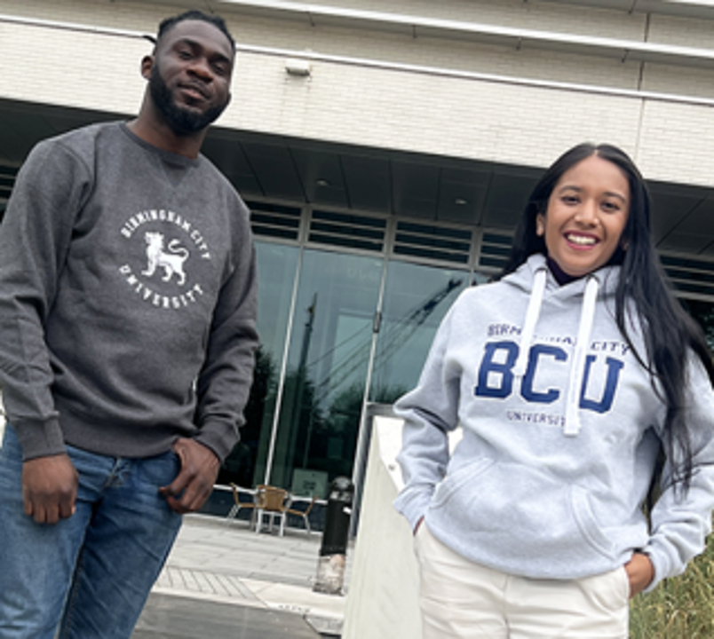 former officers waering BCU Hoodies